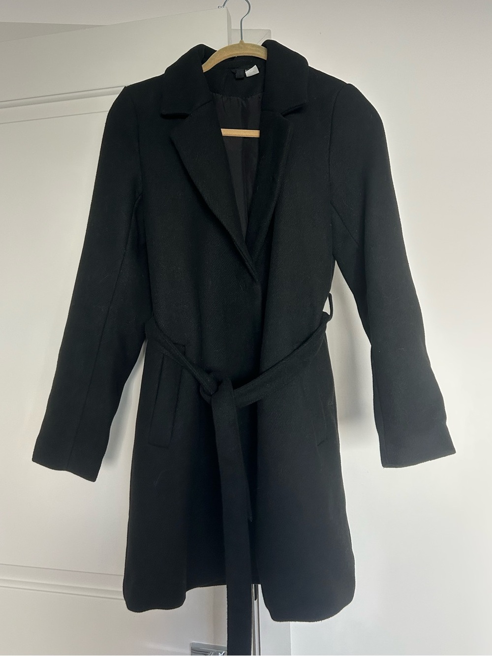 Black mid-length peacoat with tie belt